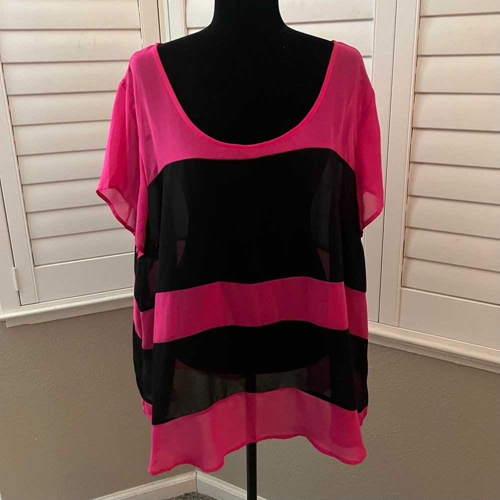 Torrid hot pink and black striped slightly sheer tunic.